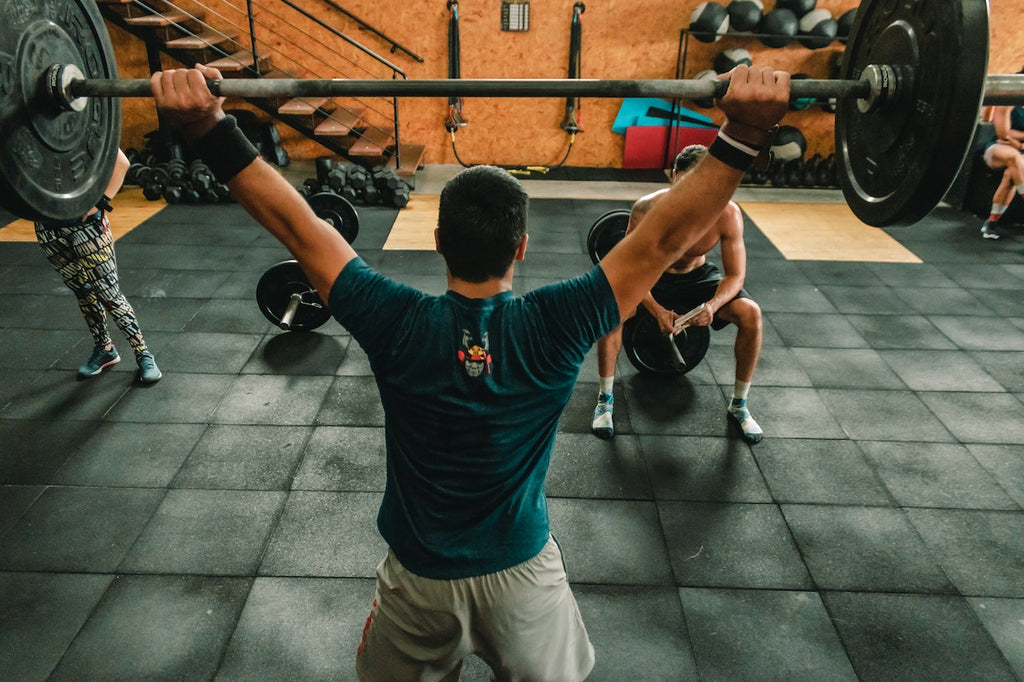 A man lifting weights at the gym